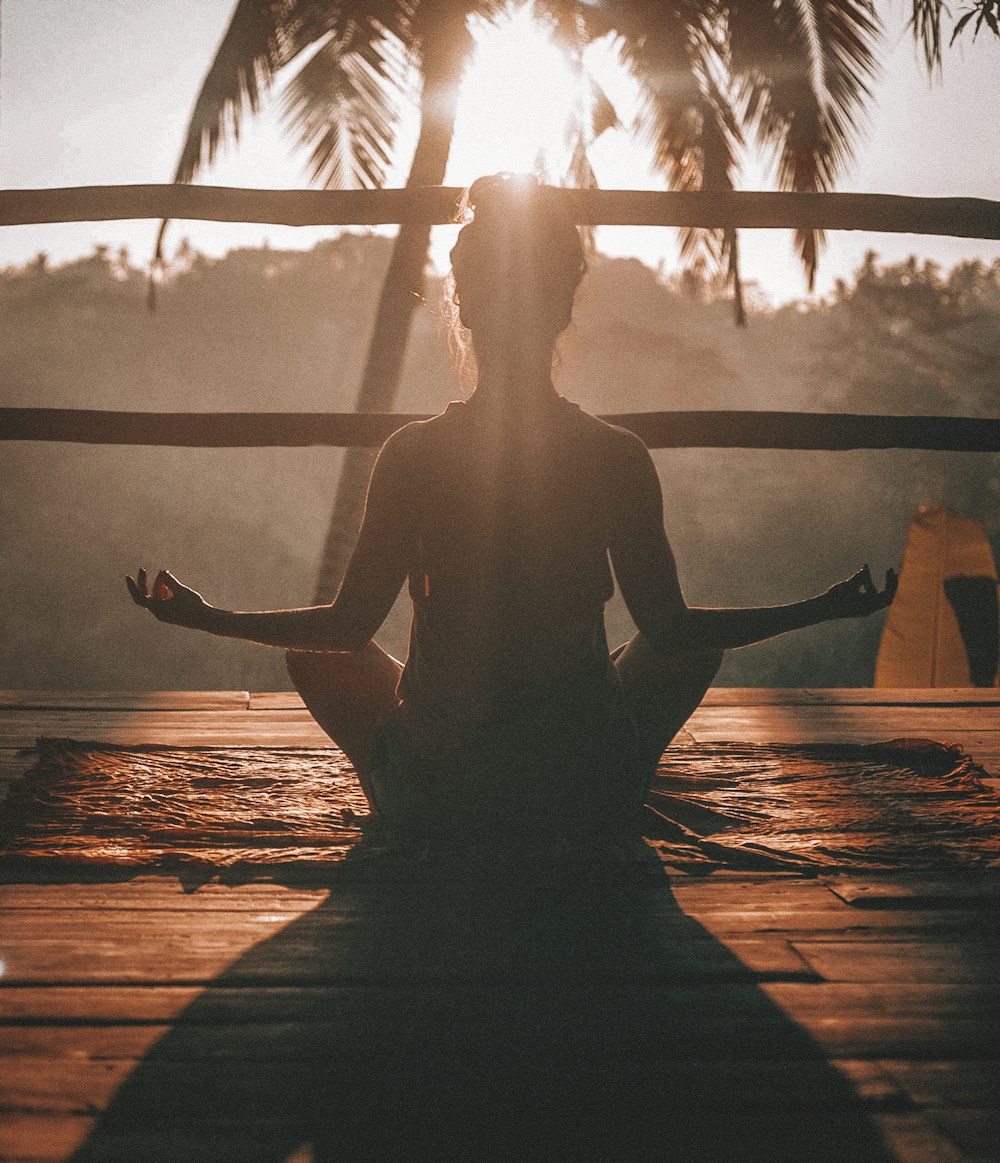 Man practicing morning stretches in clean sunlit room